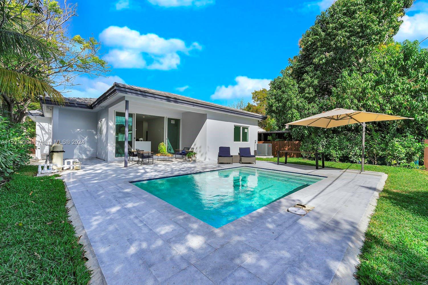 2356 Southwest 11th Street Miami, FL 33135 - Photo 26 of 51 a view of a backyard with a patio and fire pit
