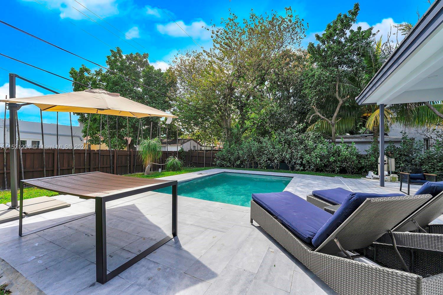2356 Southwest 11th Street Miami, FL 33135 - Photo 29 of 51 a view of a backyard with swimming pool and sitting area
