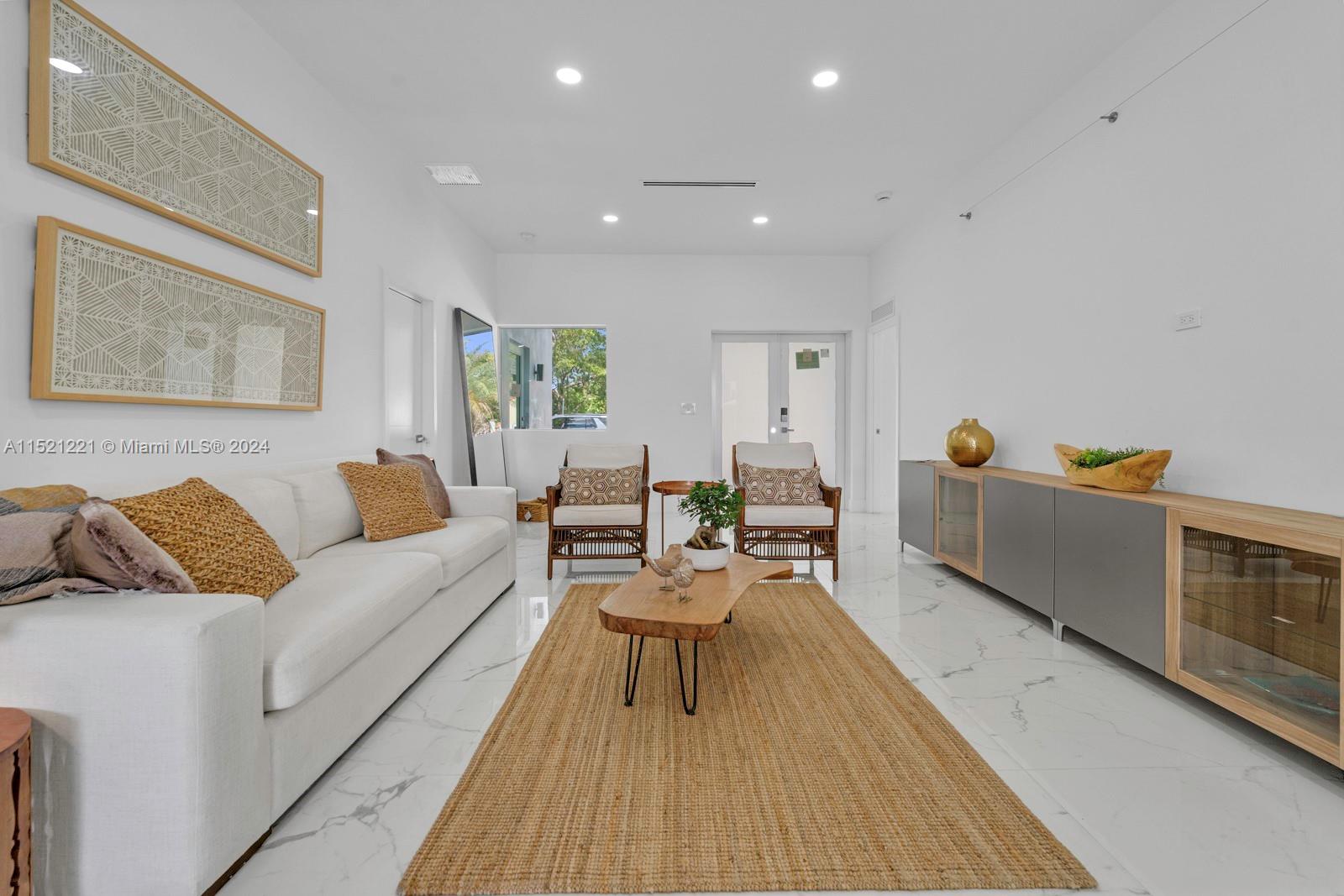 2356 Southwest 11th Street Miami, FL 33135 - Photo 31 of 51 a living room with furniture and a wooden floor