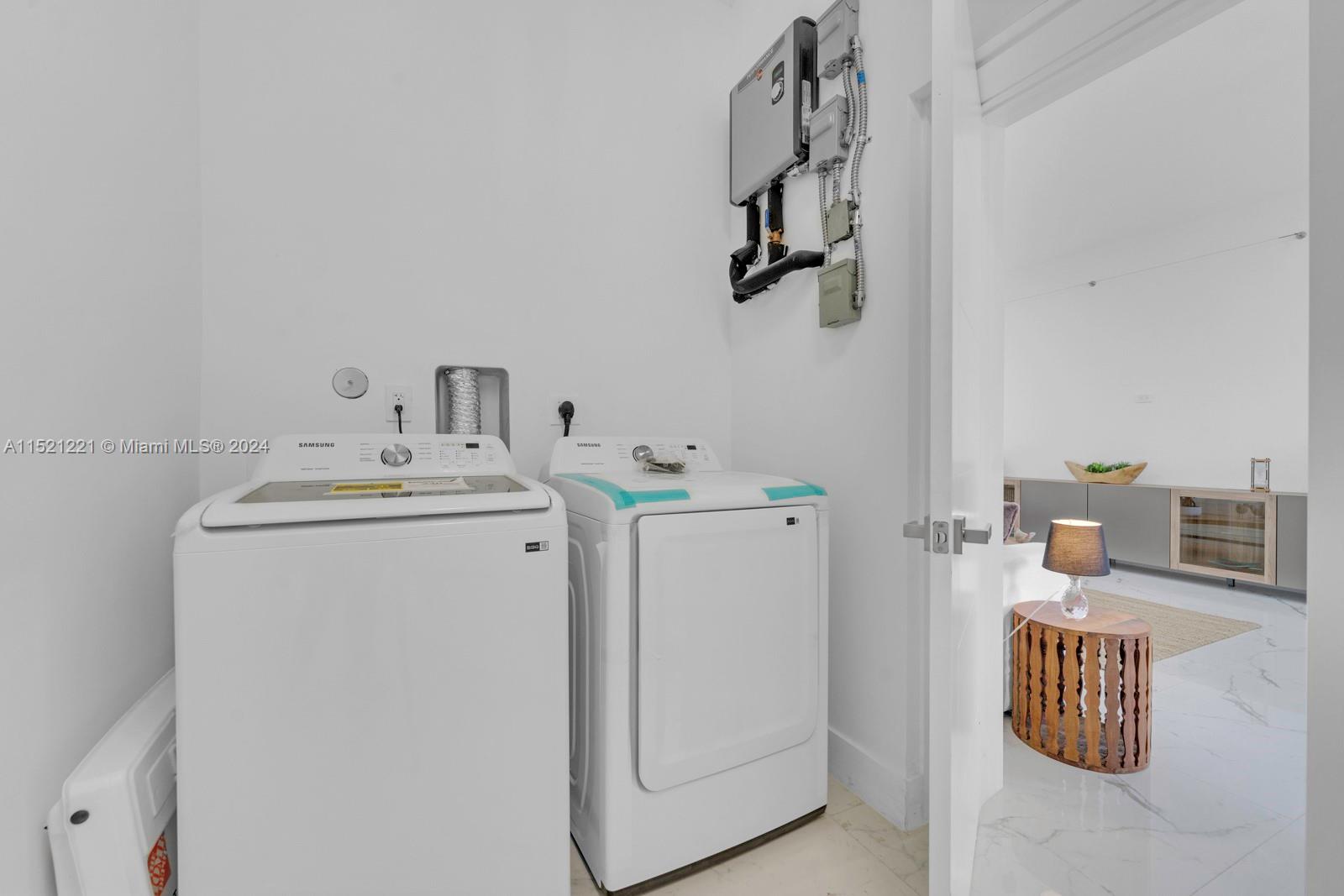 2356 Southwest 11th Street Miami, FL 33135 - Photo 32 of 51 a utility room with dryer and washer