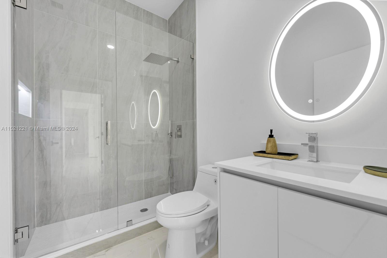 2356 Southwest 11th Street Miami, FL 33135 - Photo 35 of 51 a bathroom with a sink a toilet and shower