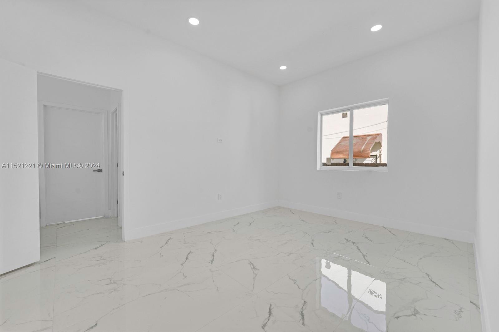 2356 Southwest 11th Street Miami, FL 33135 - Photo 36 of 51 an empty room with a window
