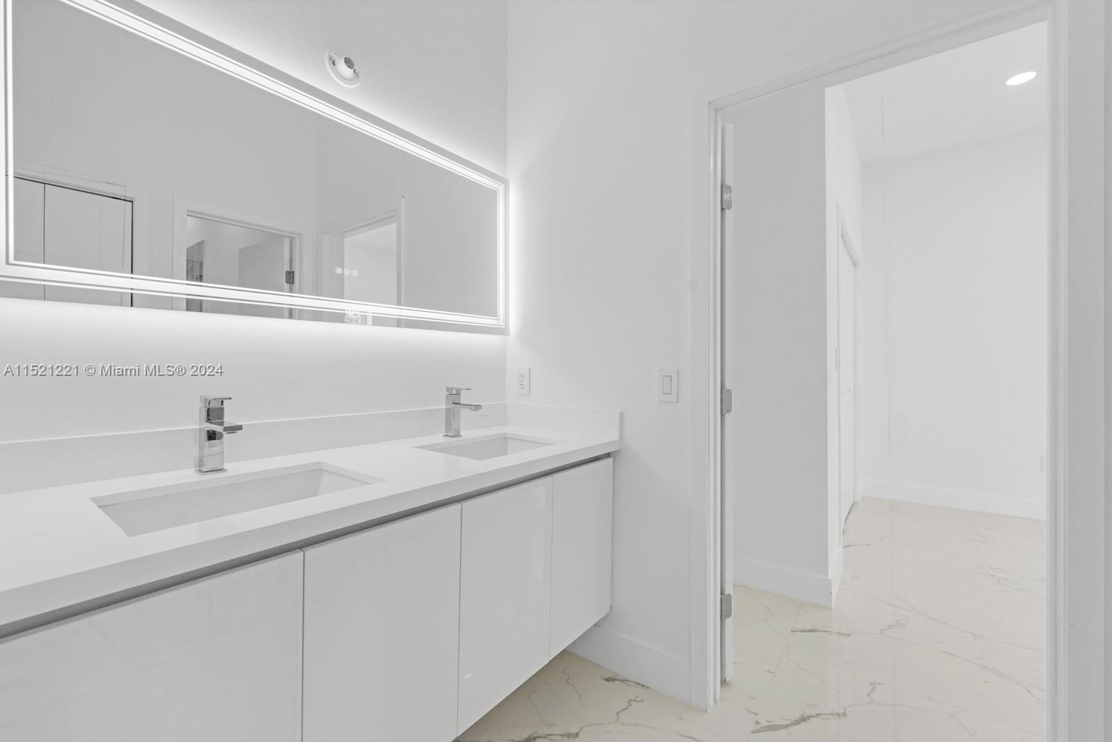 2356 Southwest 11th Street Miami, FL 33135 - Photo 37 of 51 a bathroom with a sink and a mirror