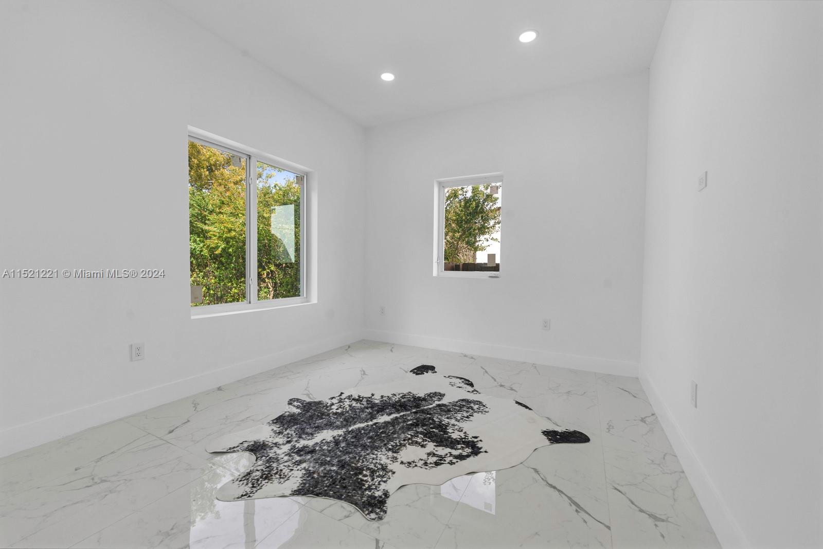 2356 Southwest 11th Street Miami, FL 33135 - Photo 39 of 51 a bathroom with a bathtub and a window