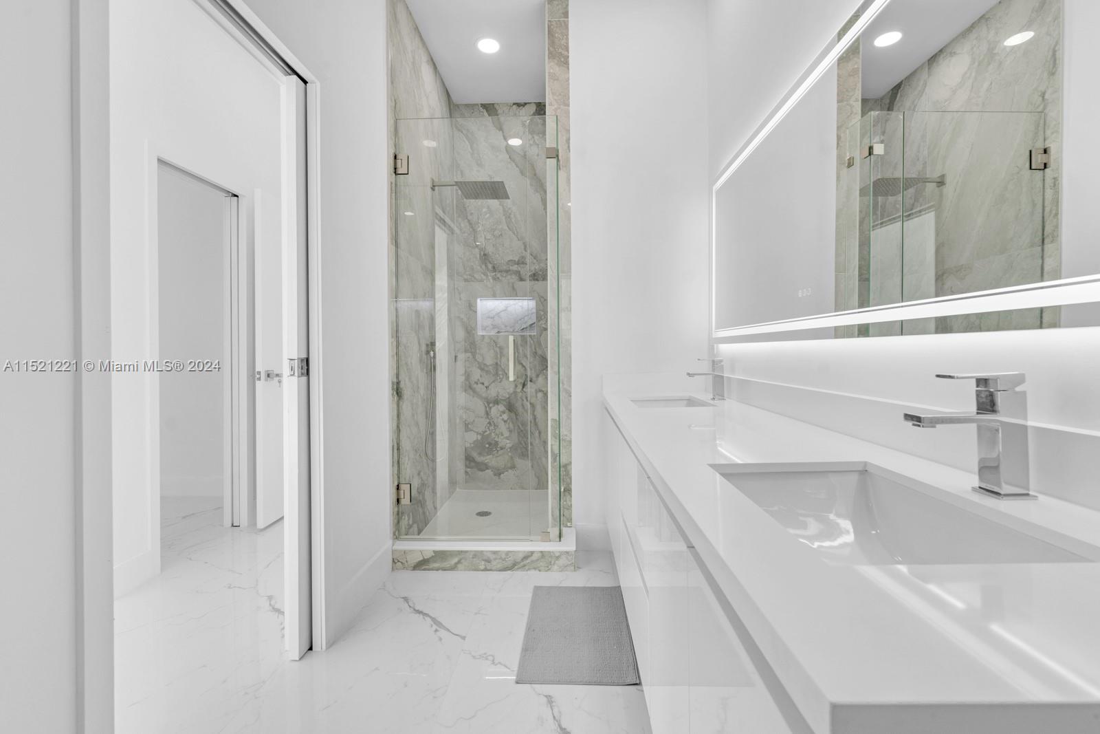 2356 Southwest 11th Street Miami, FL 33135 - Photo 43 of 51 a bathroom with a tub sink and shower