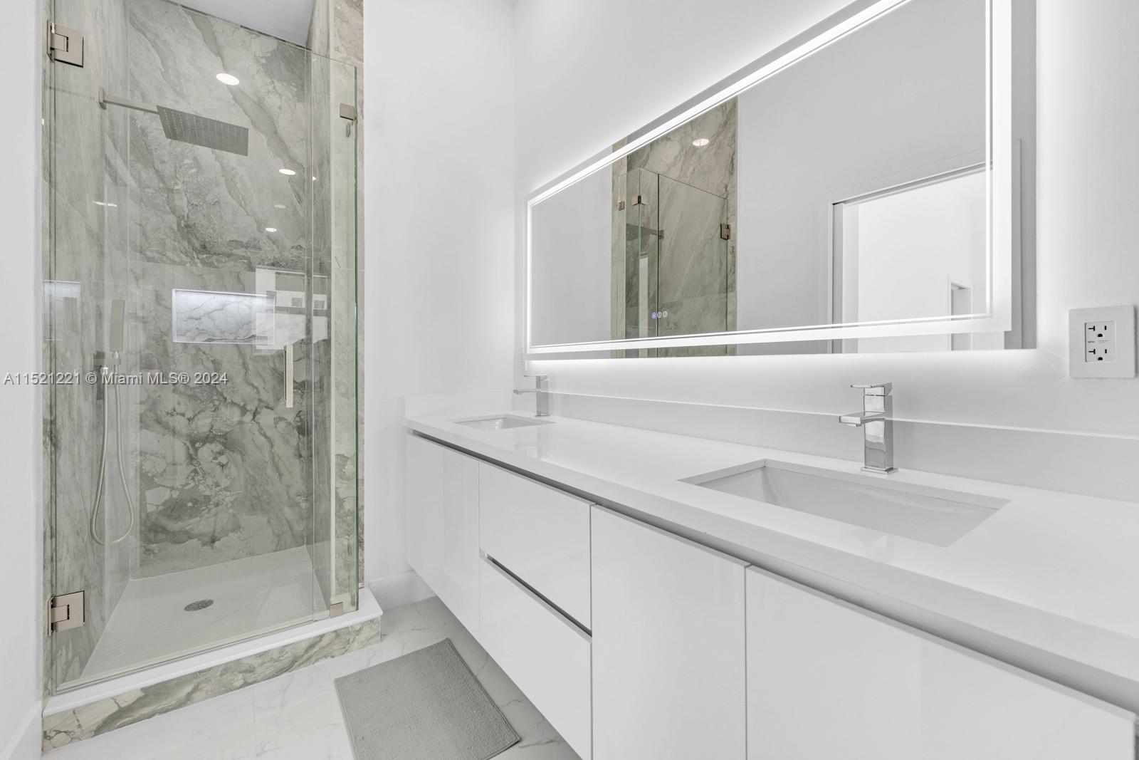 2356 Southwest 11th Street Miami, FL 33135 - Photo 44 of 51 a bathroom with a shower sink and mirror