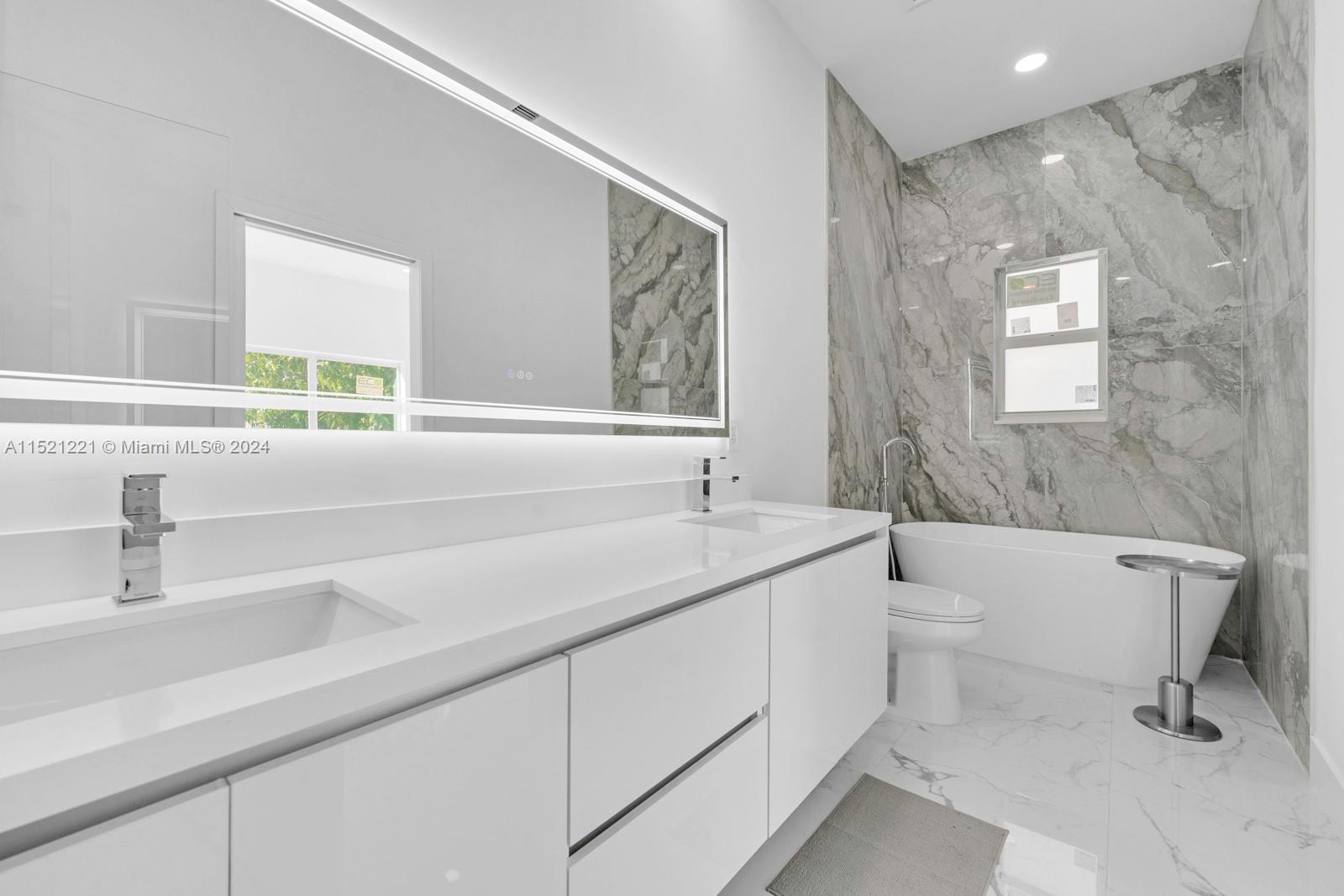2356 Southwest 11th Street Miami, FL 33135 - Photo 45 of 51 a bathroom with a sink a toilet and a bathtub