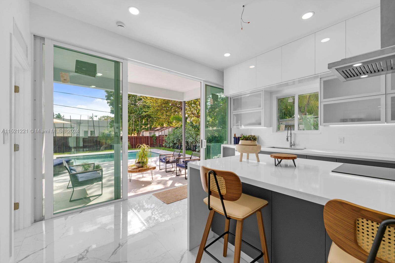 2356 Southwest 11th Street Miami, FL 33135 - Photo 46 of 51 a dining room with furniture and large windows