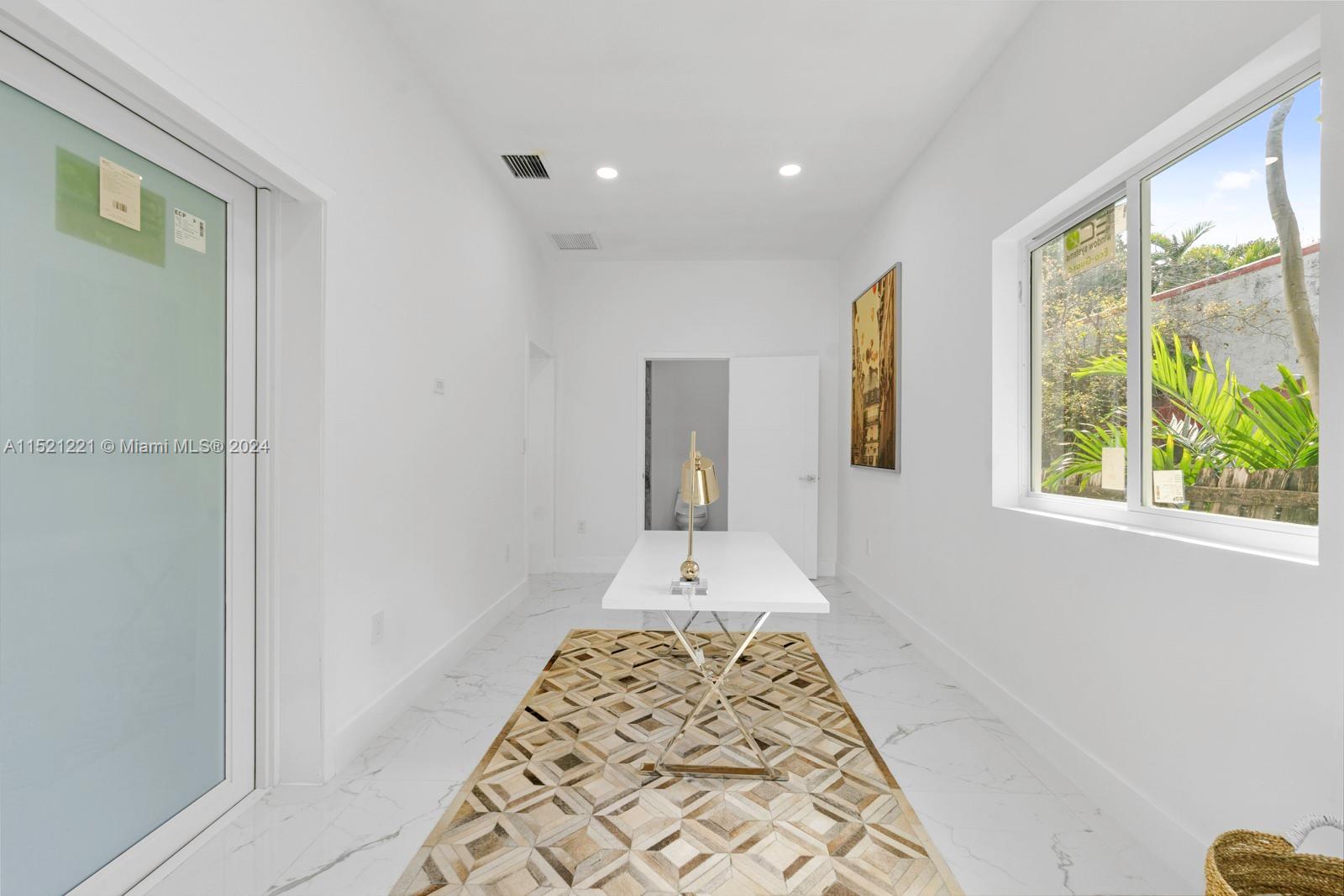 2356 Southwest 11th Street Miami, FL 33135 - Photo 49 of 51 a large space with window and wooden floor
