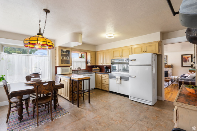 615 East Maple Street Mapleton, UT 84664 - Photo 8 of 30 Kitchen featuring light wood cabinetry, vintage built-in oven and refrigerator, and tile flooring