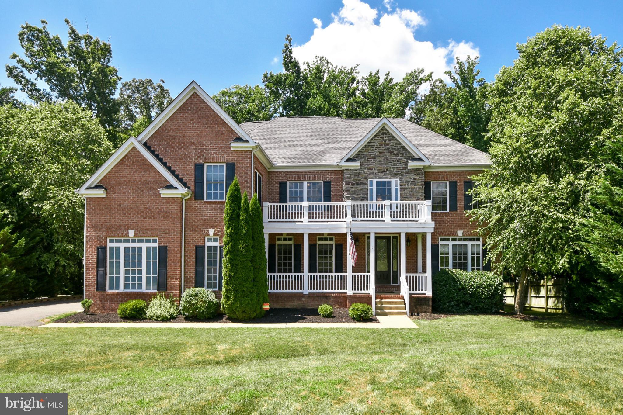 9 Johnson Mill Ridge Fredericksburg, VA 22406 - Photo 1 of 30 a front view of a house with a yard