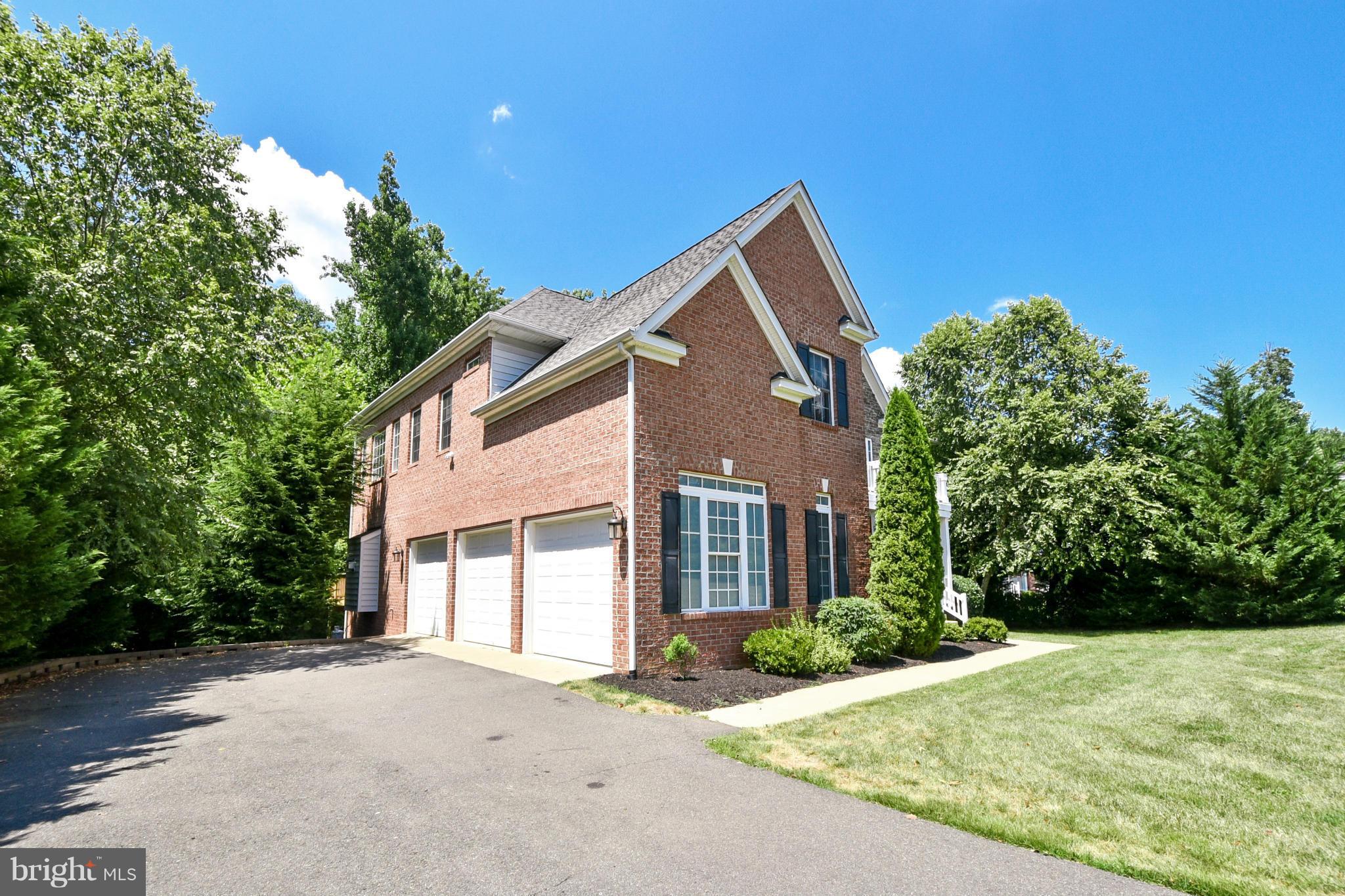 9 Johnson Mill Ridge Fredericksburg, VA 22406 - Photo 2 of 30 a front view of a house with a garden