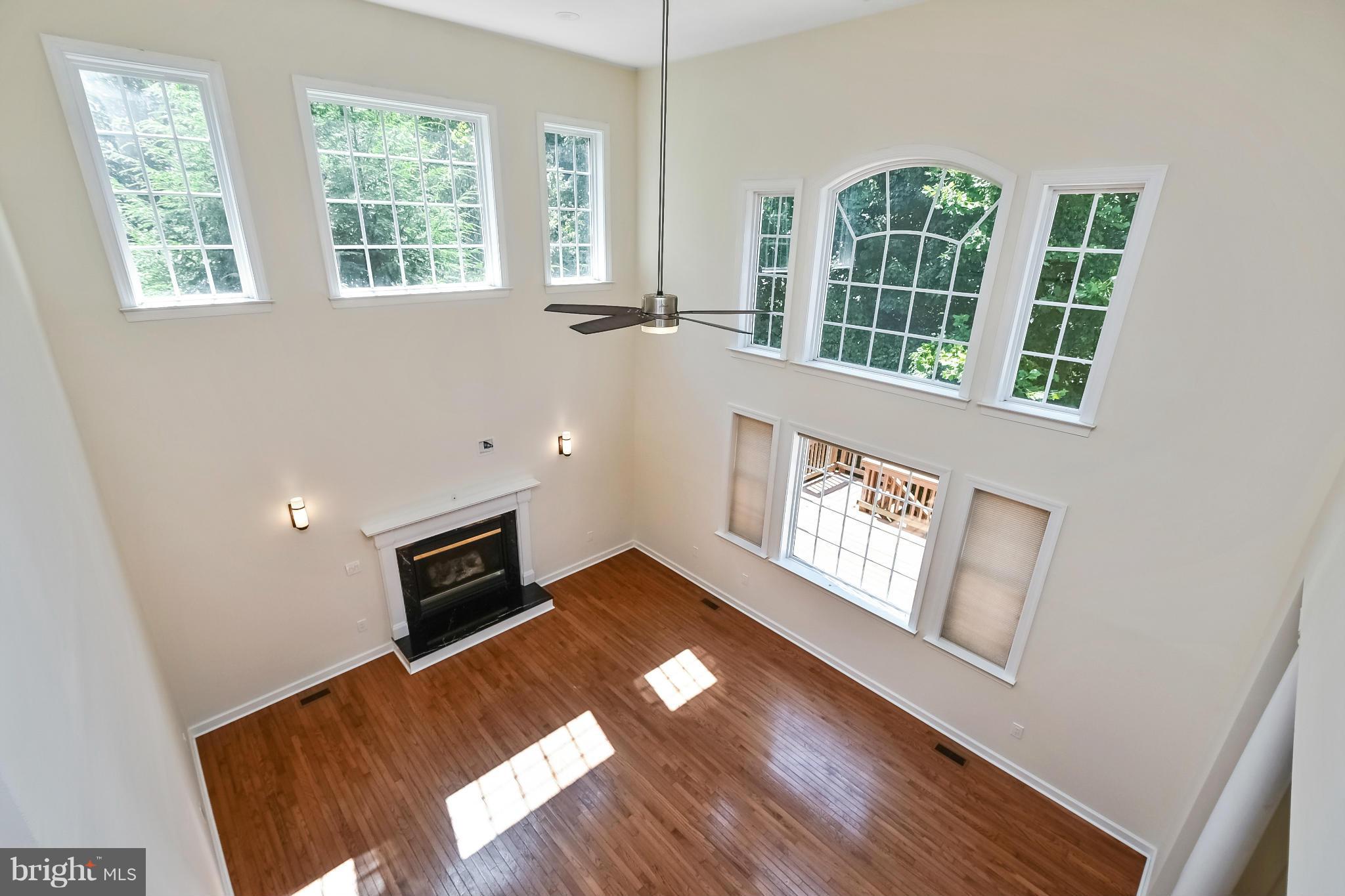 9 Johnson Mill Ridge Fredericksburg, VA 22406 - Photo 13 of 30 a view of an empty room with window and wooden floor