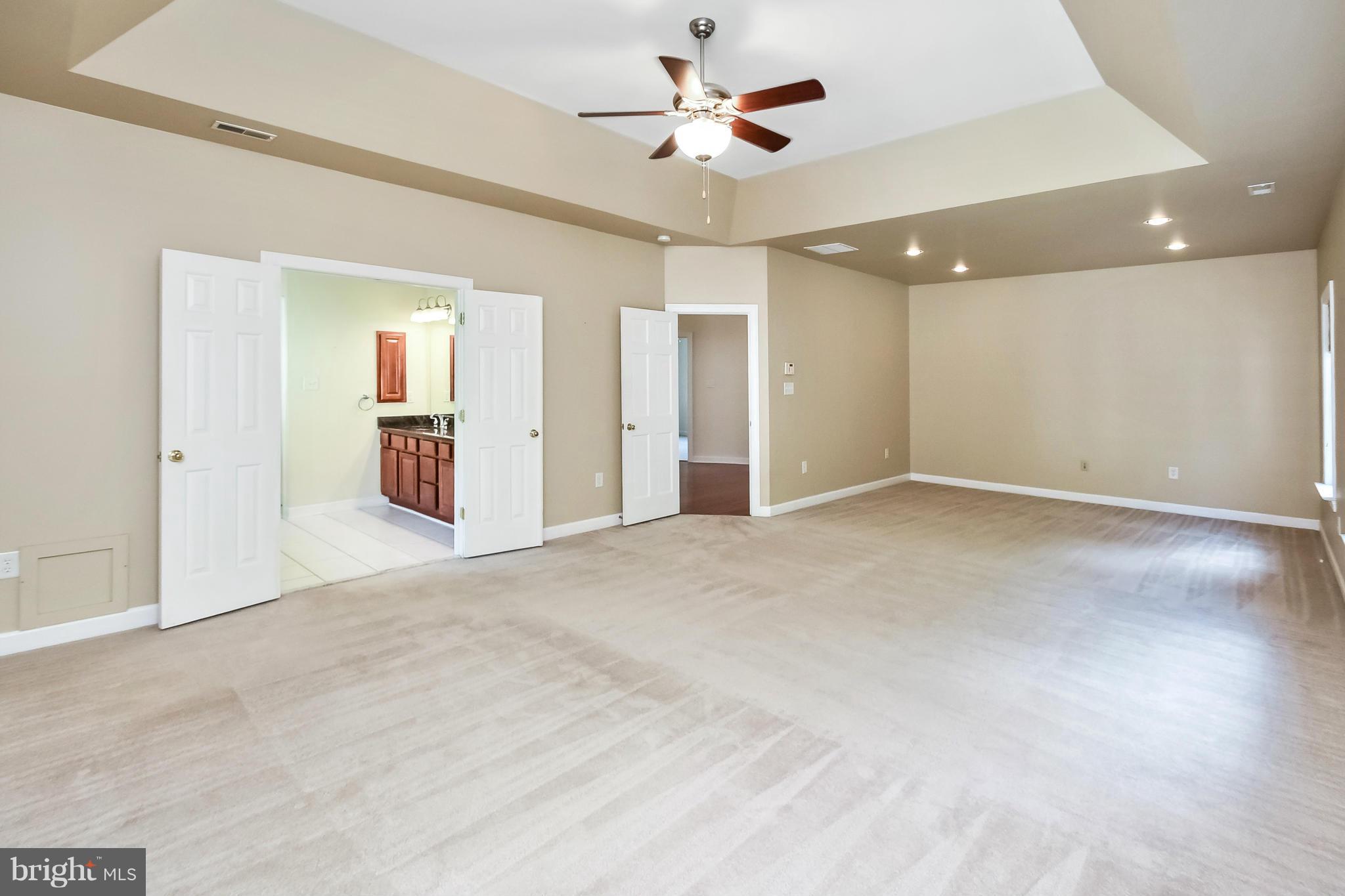 9 Johnson Mill Ridge Fredericksburg, VA 22406 - Photo 18 of 30 a view of an empty room with a ceiling fan