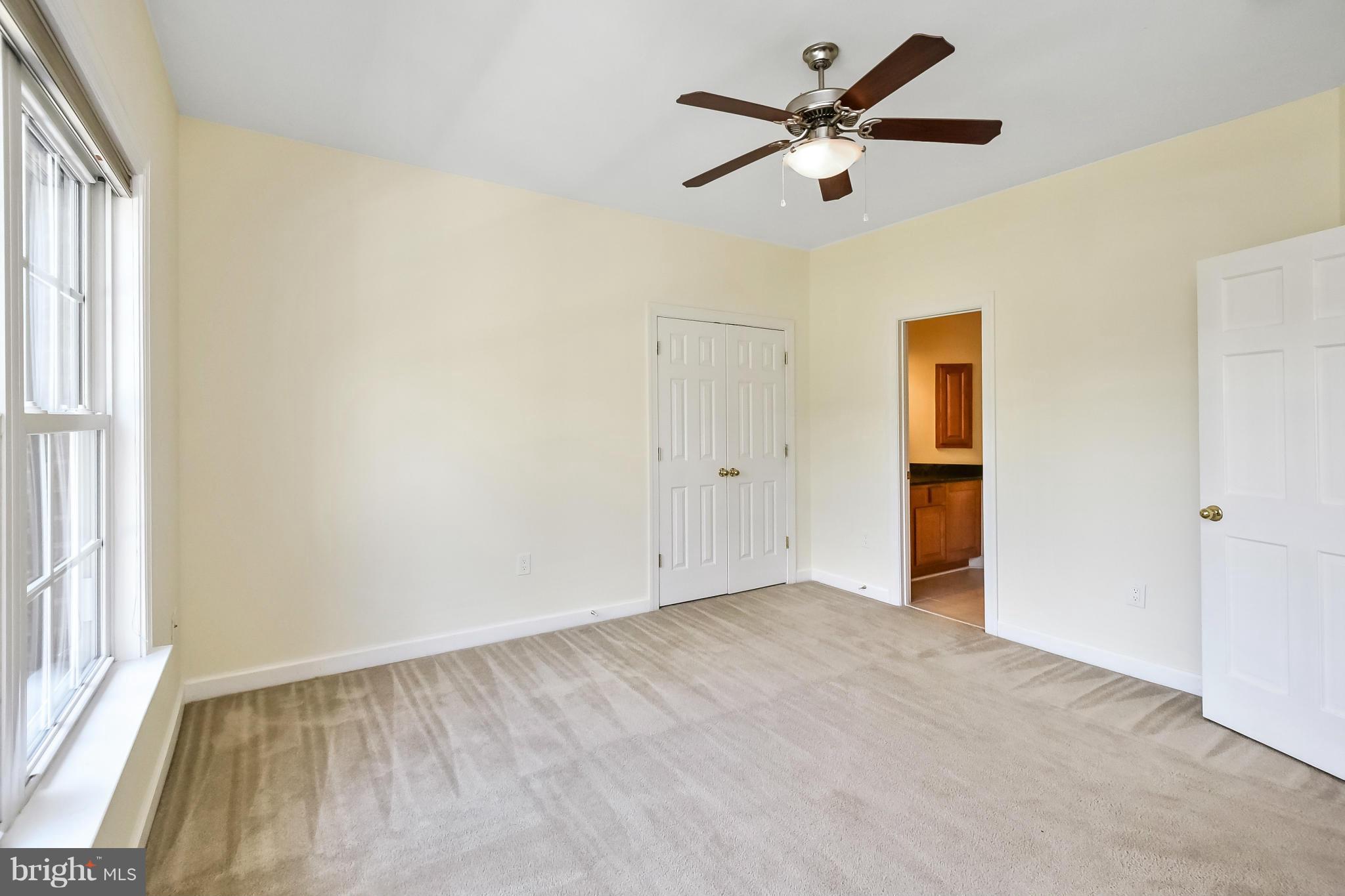9 Johnson Mill Ridge Fredericksburg, VA 22406 - Photo 21 of 30 an empty room with closet and a ceiling fan