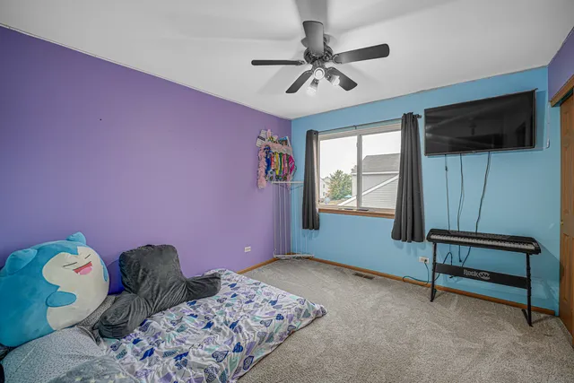 a bathroom with a double vanity sink mirror and toilet