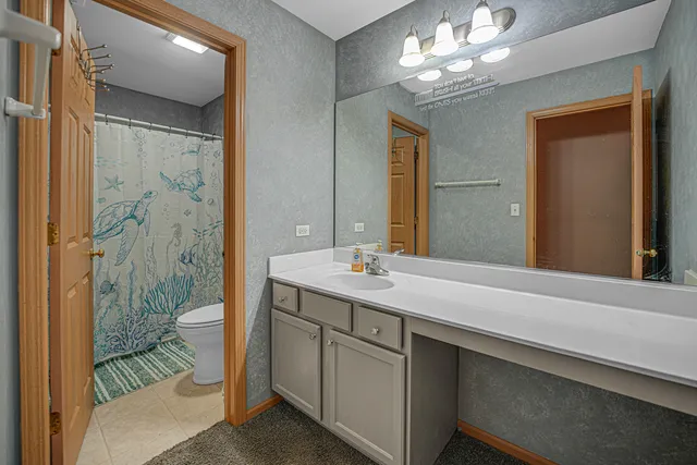 a room with furniture and a flat screen tv