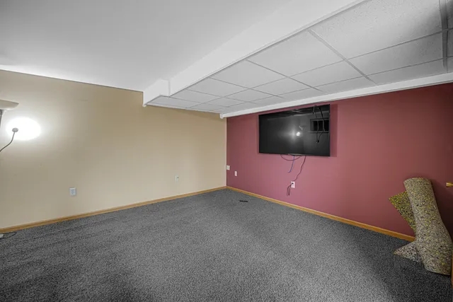 a bed room with a bed and a chandelier