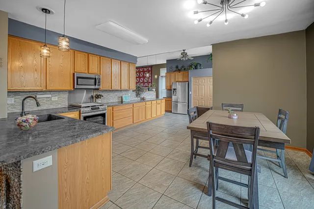 a kitchen with cabinets a sink and appliances