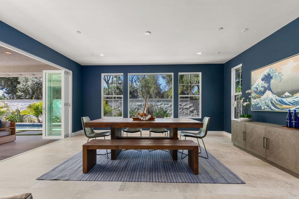 661 Jocelyn Way Encinitas, CA 92024 - Photo 11 of 21 a living room with furniture and a floor to ceiling window