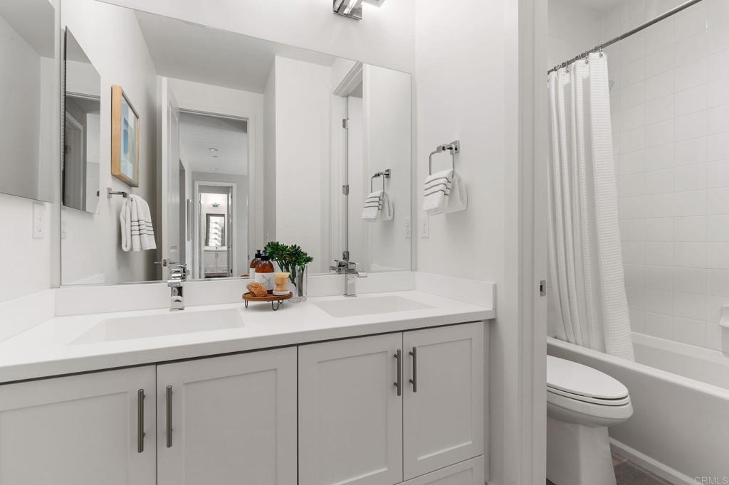 661 Jocelyn Way Encinitas, CA 92024 - Photo 17 of 21 a bathroom with a sink and a mirror