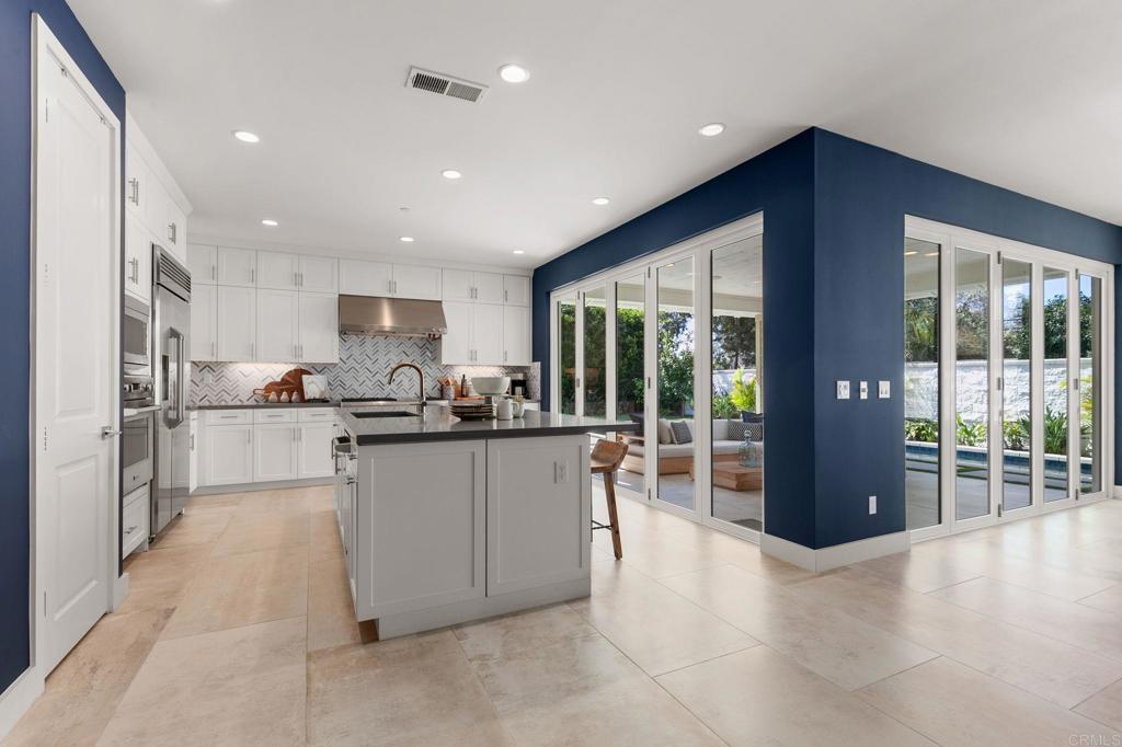 661 Jocelyn Way Encinitas, CA 92024 - Photo 5 of 21 a kitchen with stainless steel appliances granite countertop a refrigerator and a sink