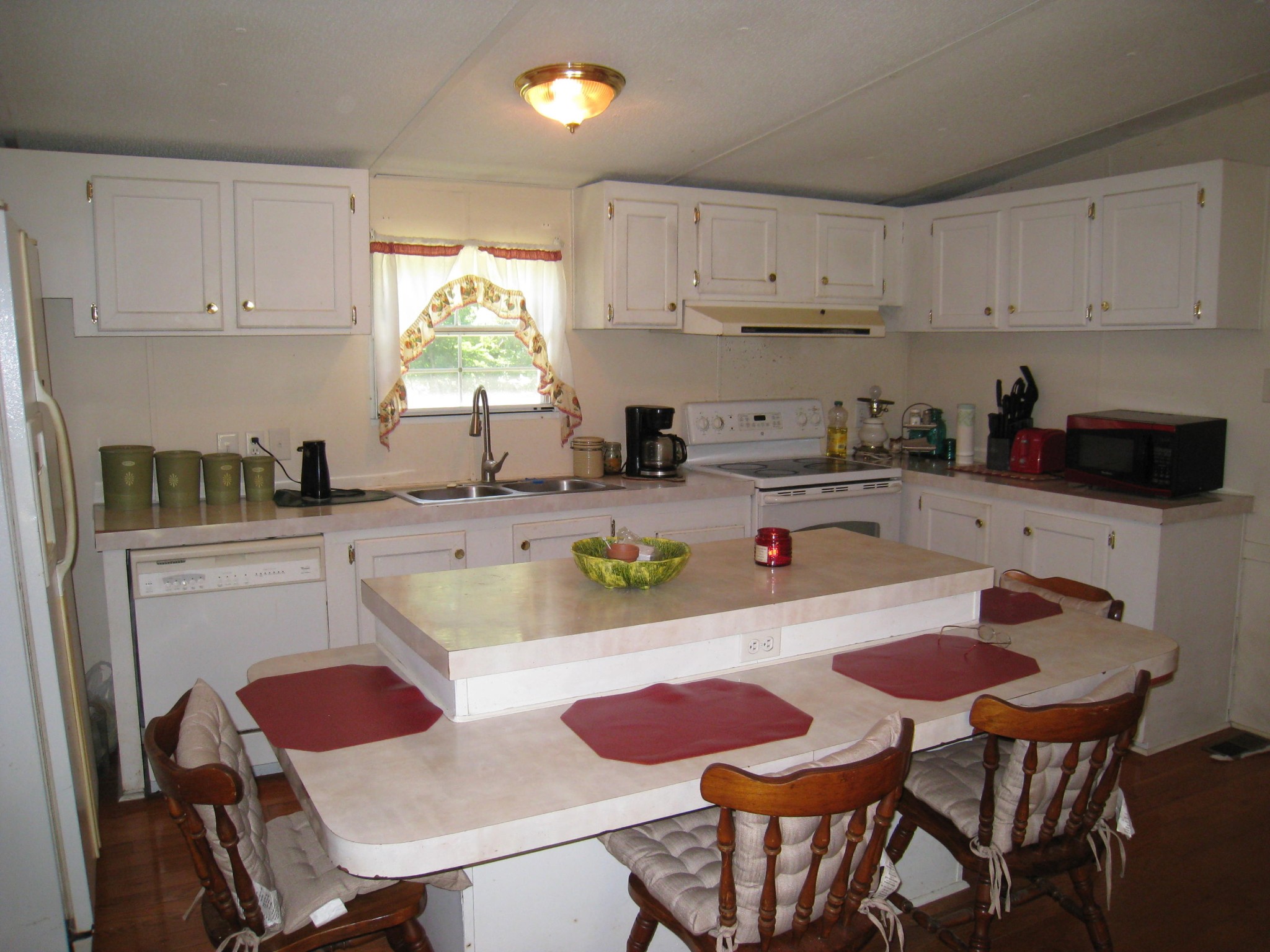 59 County Road 100 Decatur, TN 37322 - Photo 5 of 12 a kitchen with a dining table and chairs