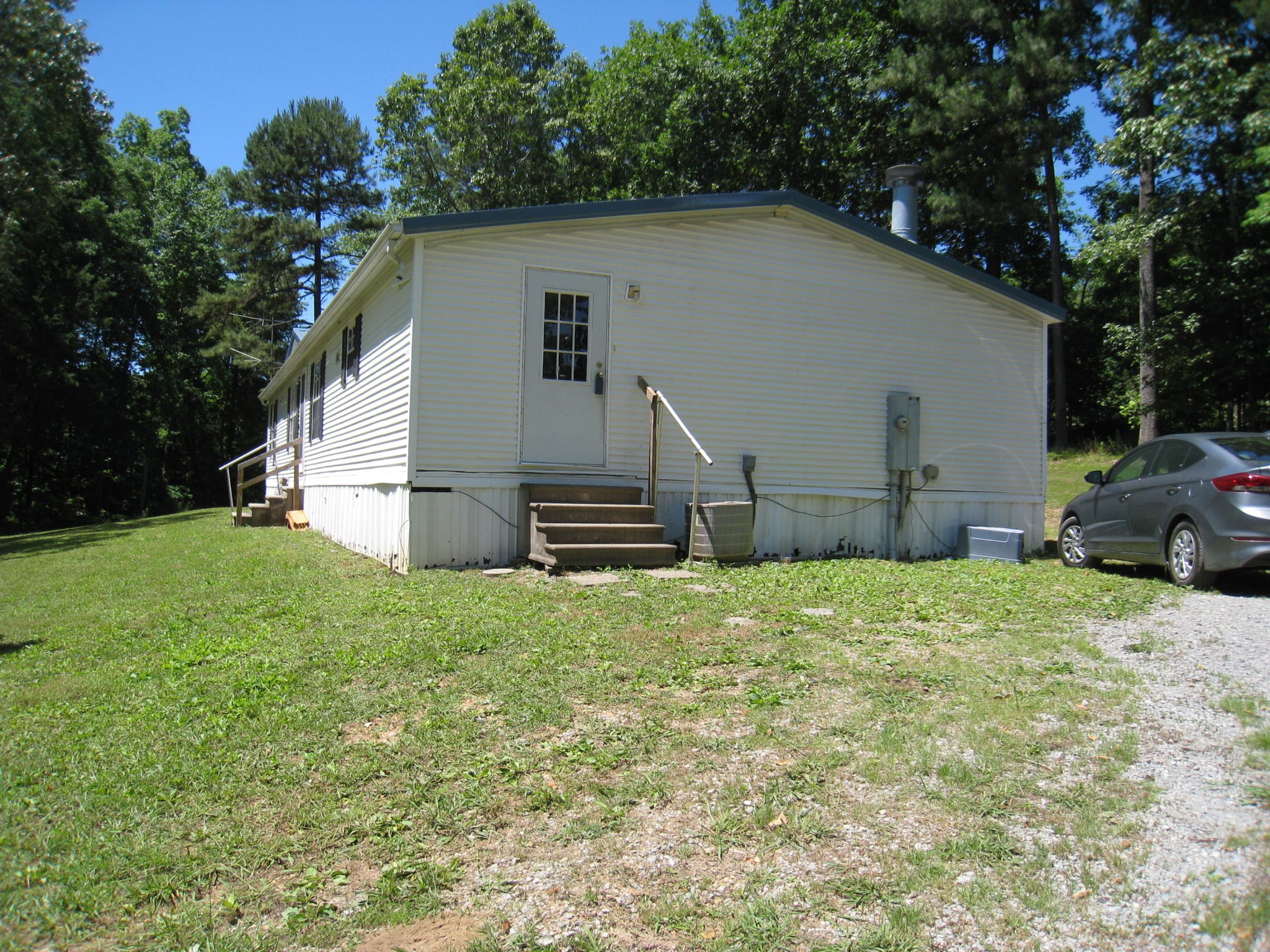 59 County Road 100 Decatur, TN 37322 - Photo 9 of 12 a house with green field in front of it