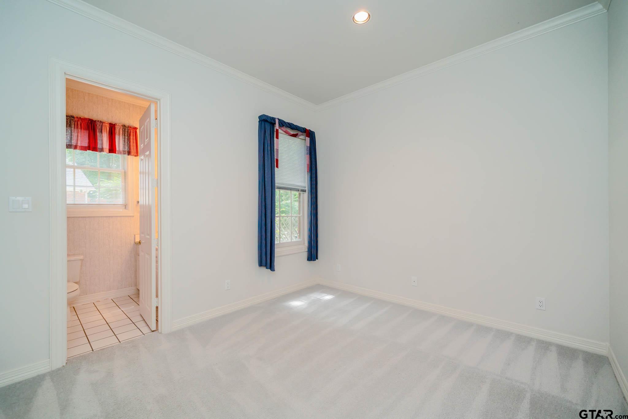 7 Summer Creek Way Longview, TX 75604 - Photo 26 of 48 an empty room with windows