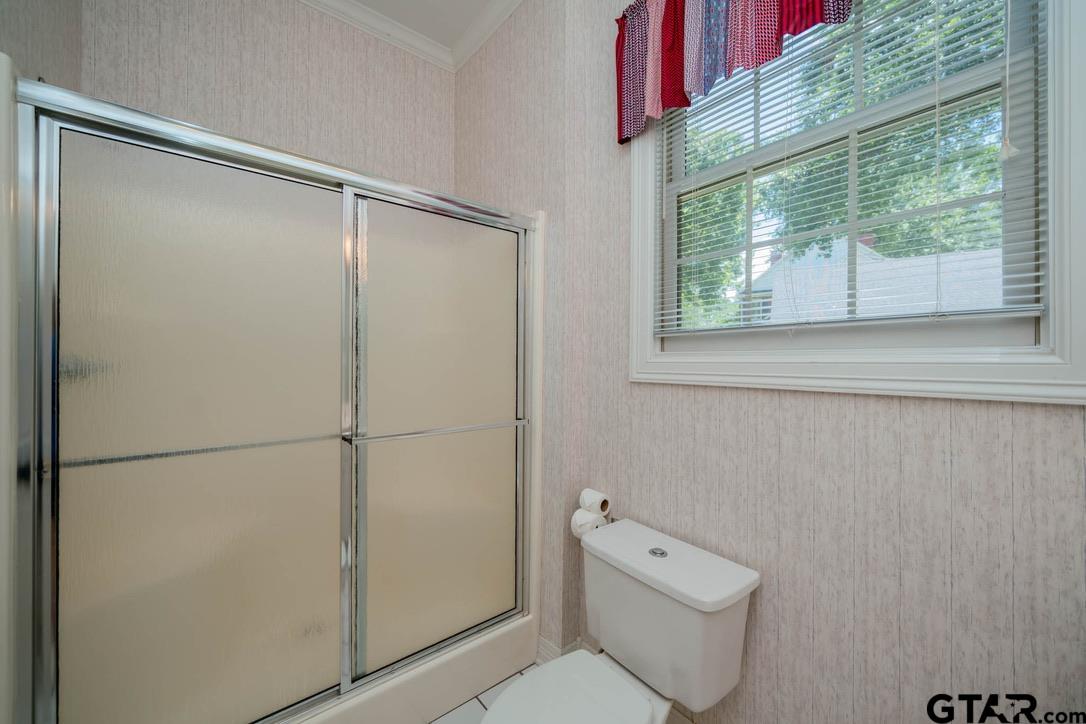 7 Summer Creek Way Longview, TX 75604 - Photo 28 of 48 a bathroom with a shower and a toilet