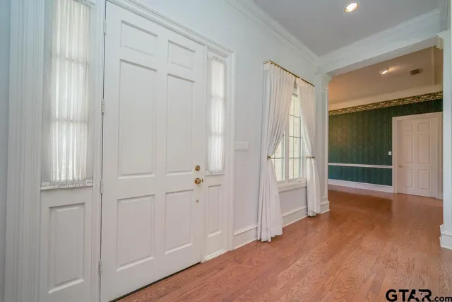 a view of entryway with wooden floor