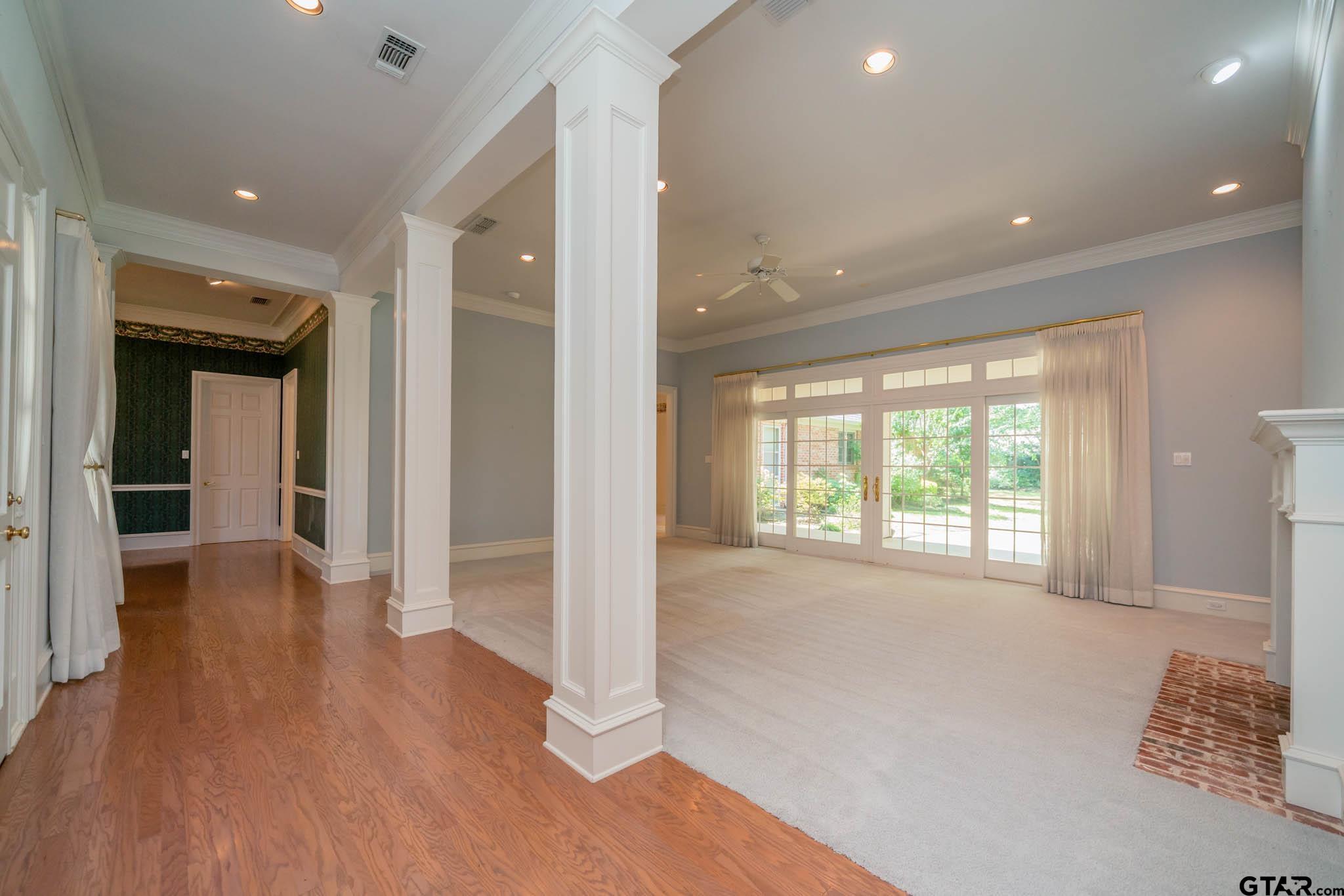 7 Summer Creek Way Longview, TX 75604 - Photo 4 of 48 a view of hallway with a big room and wooden floor