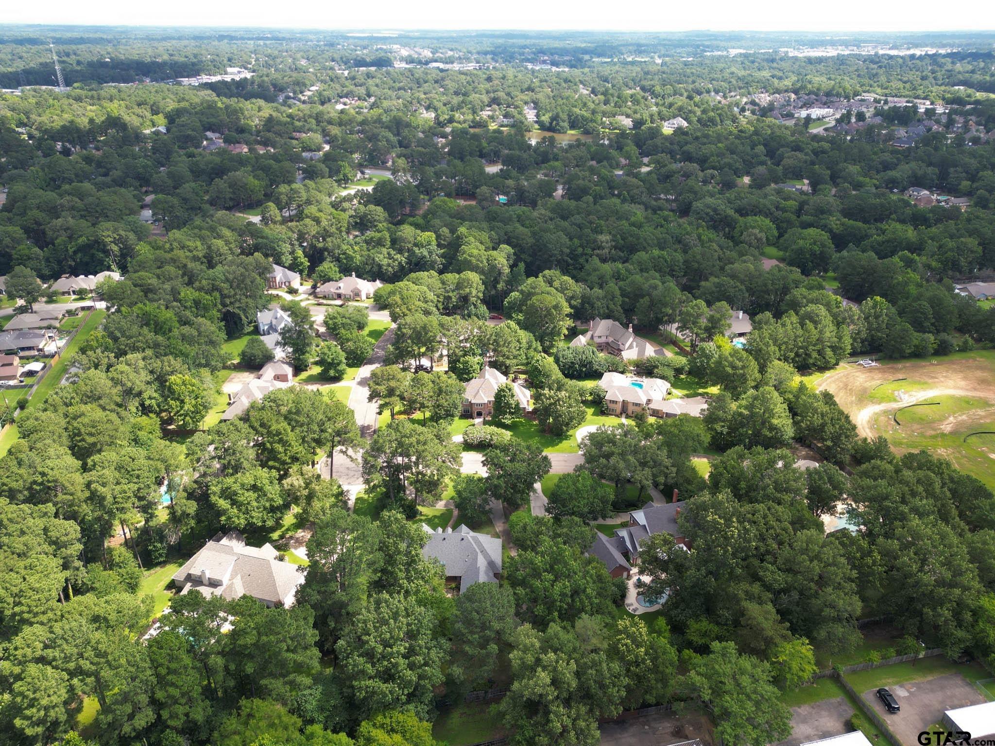 7 Summer Creek Way Longview, TX 75604 - Photo 46 of 48 an aerial view of a city with lots of residential buildings