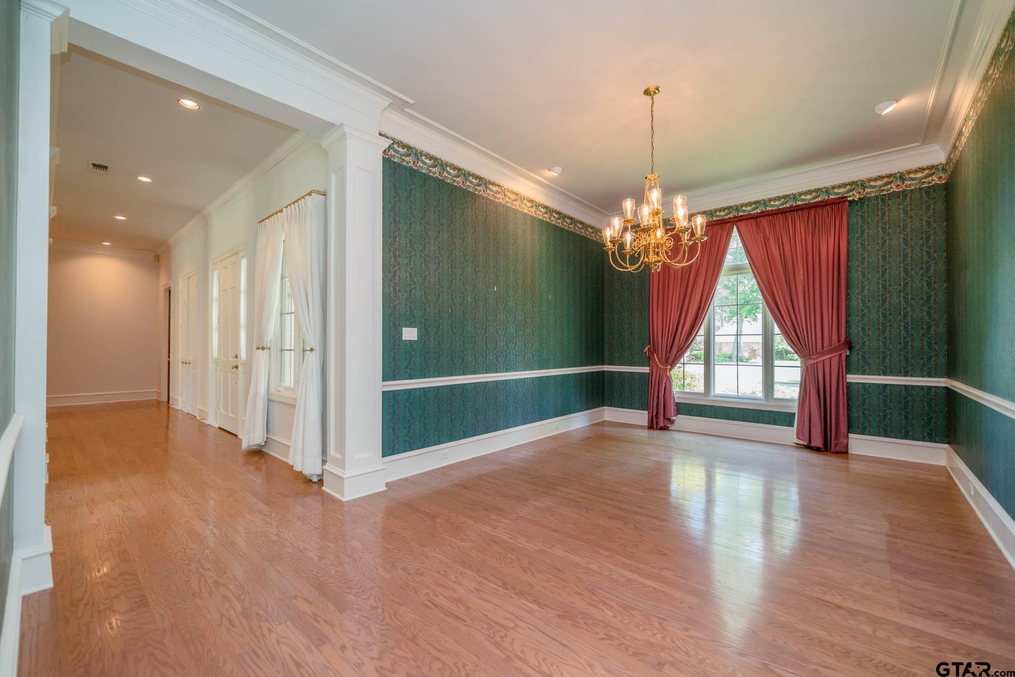 7 Summer Creek Way Longview, TX 75604 - Photo 8 of 48 a view of empty room with window and chandelier