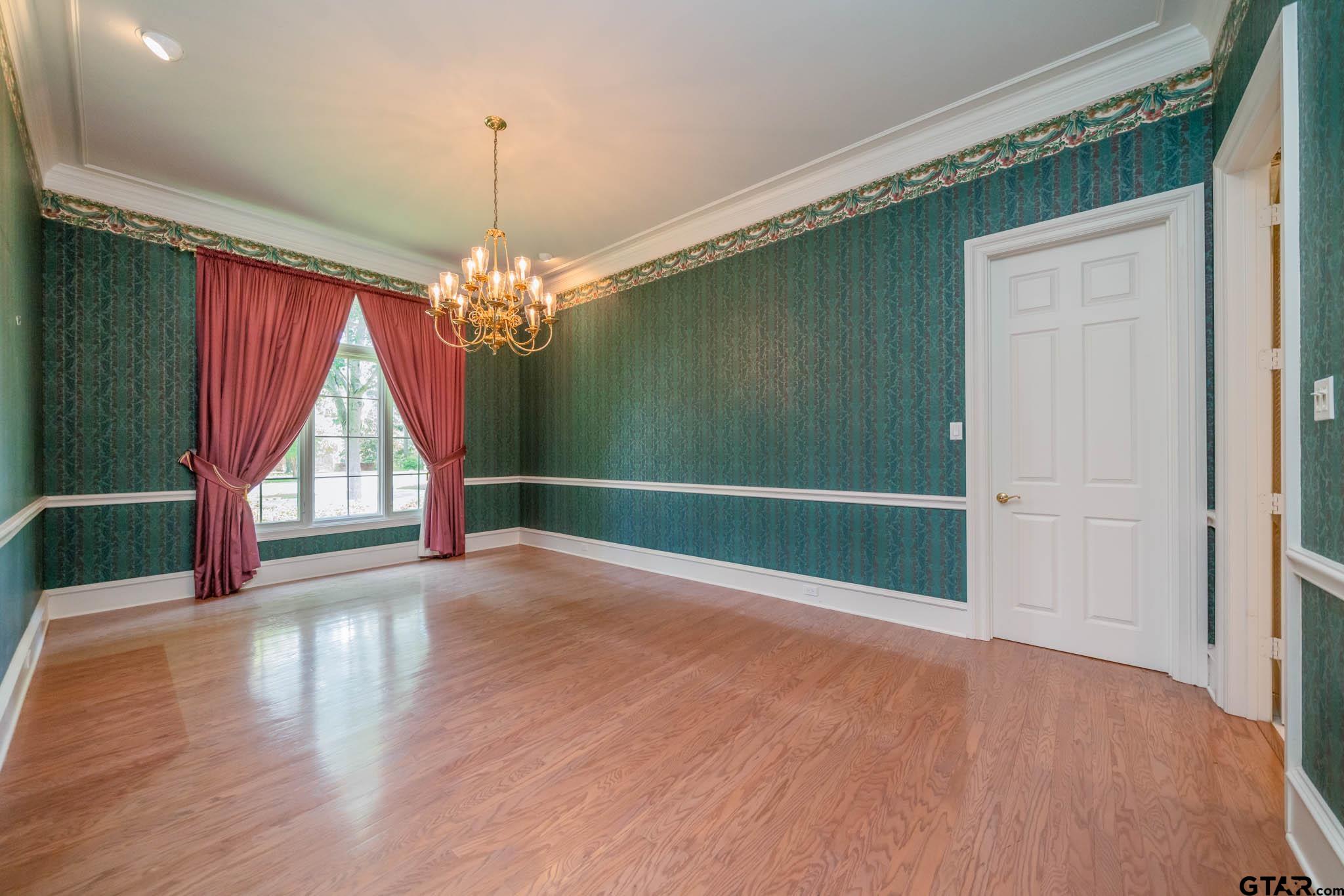 7 Summer Creek Way Longview, TX 75604 - Photo 9 of 48 wooden floor in an empty room with a window