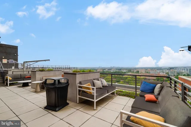 a view of a terrace with wooden floor and city view