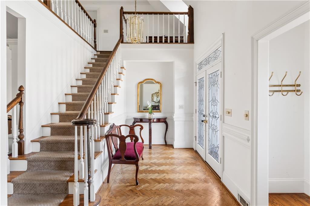 a view of an entryway with wooden floor