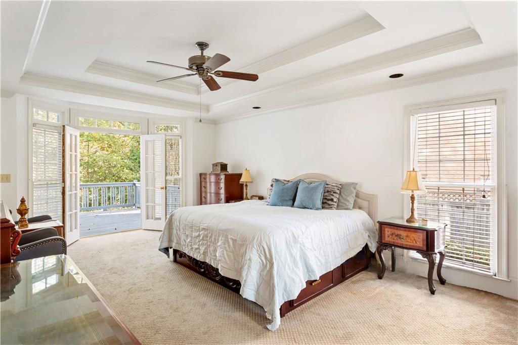 3910 Spalding Bluff Drive Peachtree Corners, GA 30092 - Photo 15 of 35 a bedroom with a bed and a large window