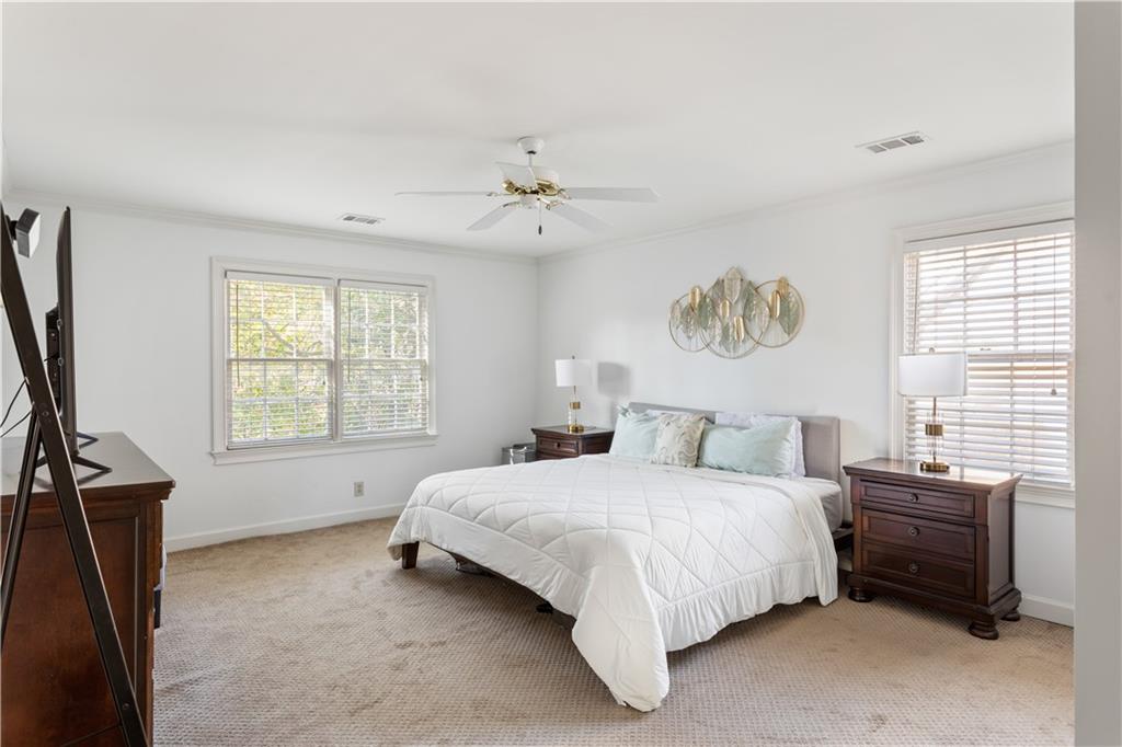 3910 Spalding Bluff Drive Peachtree Corners, GA 30092 - Photo 21 of 35 a bedroom with a bed and a window