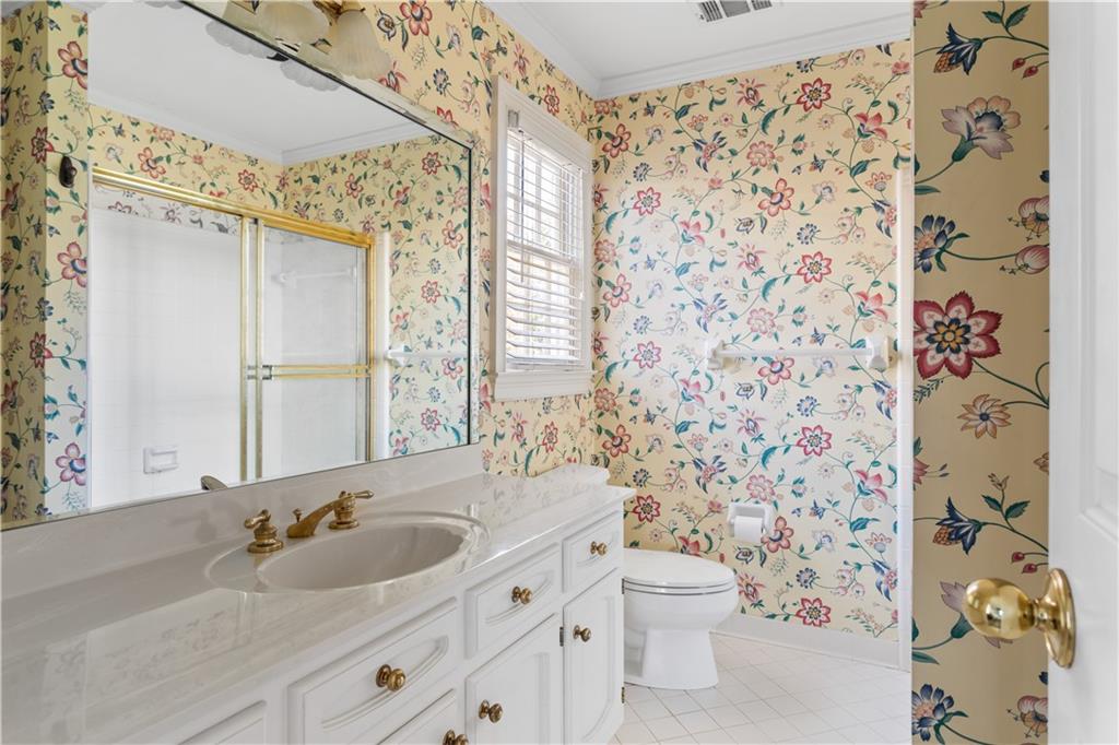 3910 Spalding Bluff Drive Peachtree Corners, GA 30092 - Photo 22 of 35 a bathroom with a sink and a mirror