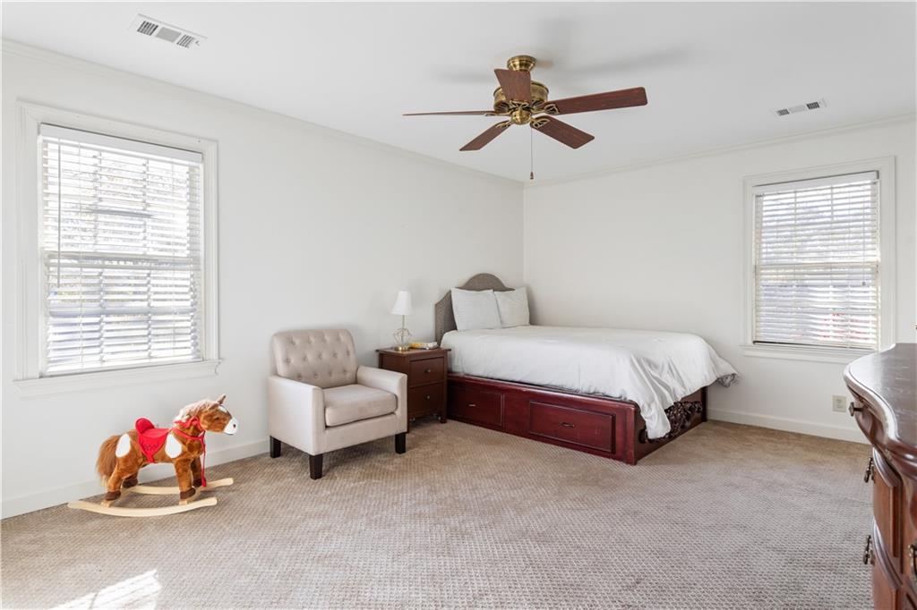 3910 Spalding Bluff Drive Peachtree Corners, GA 30092 - Photo 25 of 35 a bedroom with a bed and a window