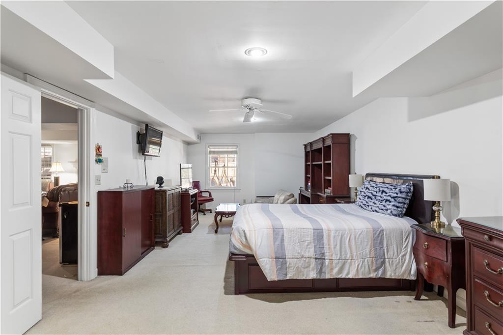 3910 Spalding Bluff Drive Peachtree Corners, GA 30092 - Photo 28 of 35 a bedroom with a bed and wooden floor