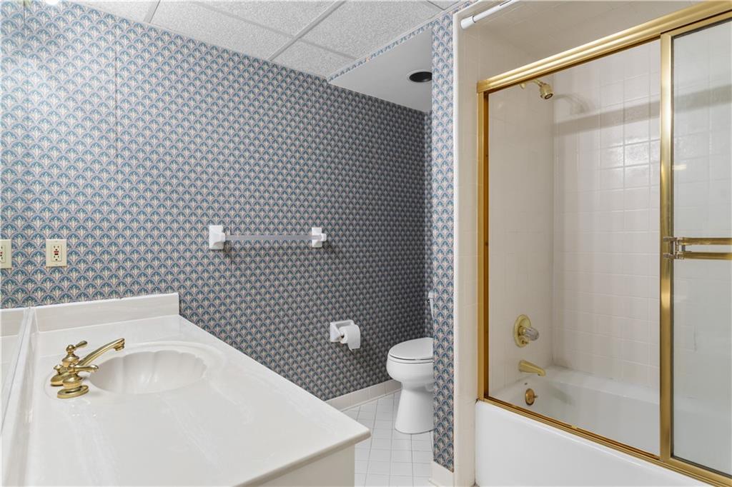 3910 Spalding Bluff Drive Peachtree Corners, GA 30092 - Photo 29 of 35 a bathroom with a sink toilet and shower