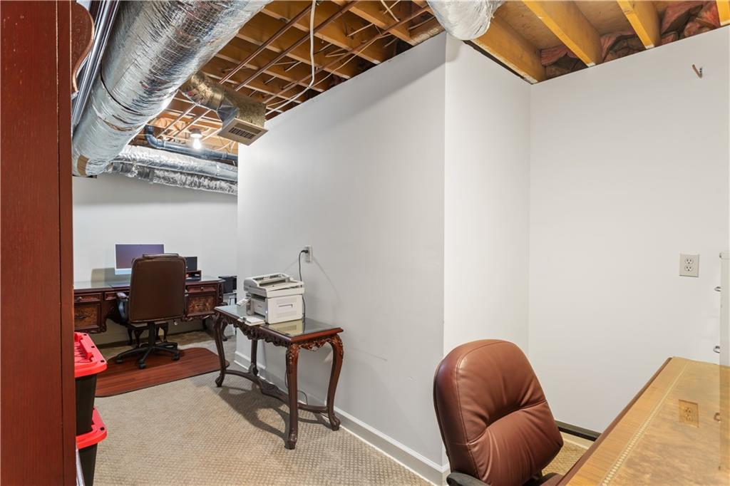 3910 Spalding Bluff Drive Peachtree Corners, GA 30092 - Photo 30 of 35 a room with furniture and a potted plant
