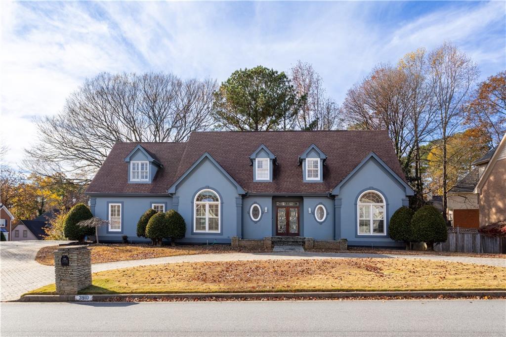 3910 Spalding Bluff Drive Peachtree Corners, GA 30092 - Photo 31 of 35 a front view of a house with yard and trees