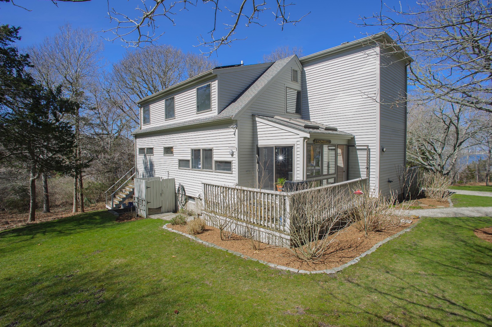 237 Lagoon Pond Road Vineyard Haven, MA 02568 - Photo 3 of 21 a view of house with a yard