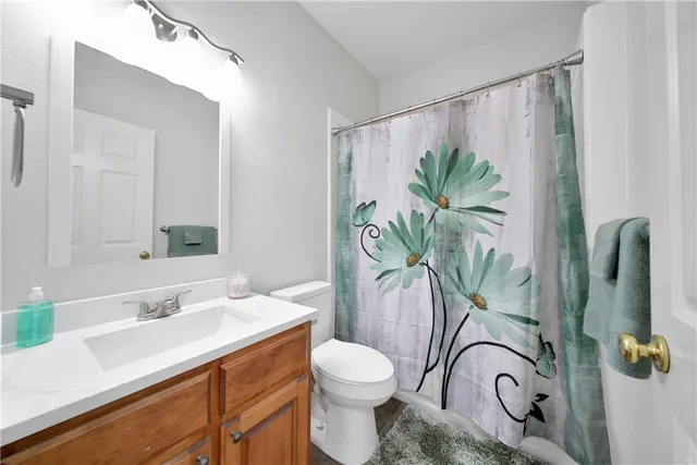 a bed room with a bed and a window