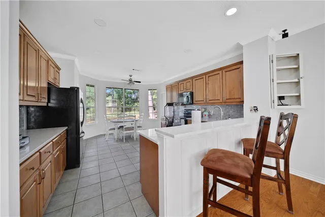 a kitchen with a dining table and chairs