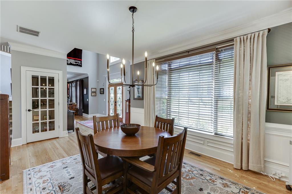 2758 Pathview Drive Dacula, GA 30019 - Photo 10 of 48 a view of a dining room with furniture window and wooden floor
