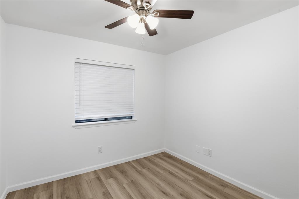 6646 East Lovers Lane, Unit 1201 Dallas, TX 75214 - Photo 11 of 24 an empty room with a window and a fan